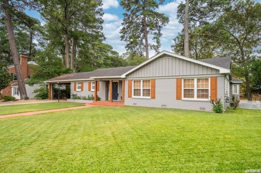 Beautiful historic home just steps from Oaklawn Racetrack and Casino.  Walk out your back yard and you are on Oaklawn Park property, it's that simple. This luxurious home has been totally updated, but still has the historic feel & layout of the era in which it was built. Kitchen features upscale appliances with a breakfast bar.  Big Family room with walls of windows. Living area with beautiful brick fireplace. Hardwood floors. Adorable & private landscaped backyard. Its central location is close to downtown, bathhouses, the lakes and Oaklawn Park. Perfect home to entertain and enjoy the scenery.  Three bedrooms and three baths plus two living areas and a lot more!