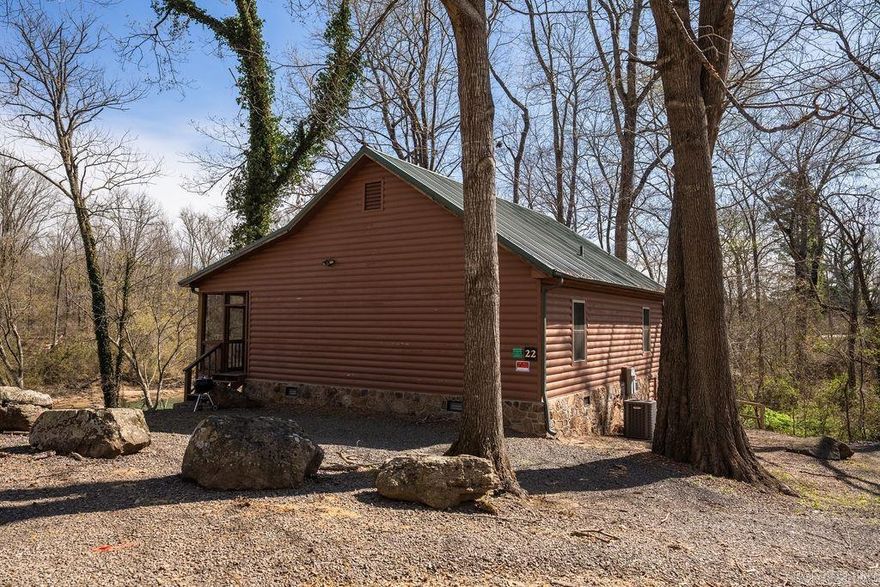 Little Red River-Welcome to the riverside splendor of Cabin 22 at Lobo Landing in Heber Springs—a stunning 2-bedroom VRBO sanctuary that elevates retreat living to new heights! Perfectly poised along the riverfront, this captivating haven offers riverside views and is tailor-made for those arriving with boats in tow. Sprawling across the largest lot in Lobo Landing, this immaculate escape features a durable metal roof, a delightful screened porch, and rustic accents with elegance where you can bask in the soothing river whispers. Fully furnished with refined elegance, its two cozy bedrooms promise comfort and charm in equal measure. Positioned closest to the boat launch and marina, with ample additional parking, this cabin blends unrivaled convenience with serene luxury. A stone’s throw from the water’s edge and complete with a fire pit for enchanting nights, Cabin 22 is riverfront perfection. Act swiftly—contact agent today to arrange an exclusive tour of this extraordinary retreat, with a courteous 24-hour notice required to step into its magic!
