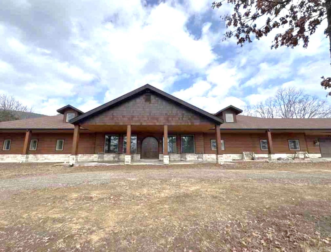 Secluded 6 BR 4 BA Home on 37 Acres m/l outside Clarksville! This home has so much to offer with it's 2 Master Suites, Wrap Around Porches, A Large 50 x 75 Shop Building that's heated and cooled. This Home is almost complete with the stunning renovations including, Quartz and Butcherblock Countertops, New Bathrooms, New Kitchen, New Staircase and, so much more! There's a kitchenette upstairs, Several Storage Rooms, and a Mud Room off the 3 Car Garage! The 37 Acres m/l has a pond and, plenty of pasture and woods also!