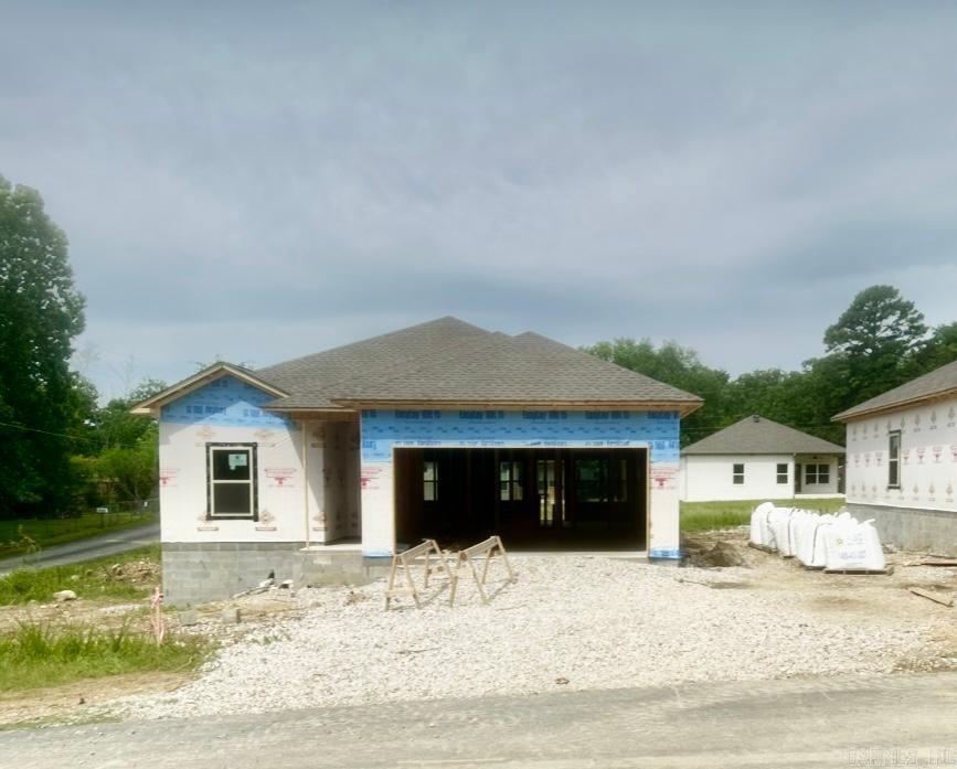 A LANCE LEVI CONSTRUCTION- New Quality Built Home!! Immaculate, new construction home is a true showcase of modern luxury and craftsmanship.This 3-bedroom, 2-bath all electric home, including the water heather & central heat, offers the perfect blend of style, comfort, and functionality. With luxuryvinyl plank flooring by Shaw and granite/quartz countertops, in kitchen and baths, the interior is designed with an elegant, contemporary feel. The homefeatures 9-foot ceilings that create an airy, open atmosphere, while insulated doors and walls enhance energy efficiency. The primary suite is a privateretreat, complete with a luxurious walk in shower. The exterior is equally impressive, with a striking brick facade with vinyl soffit & metal fascia, and afiberglass front door that provides both durability and curb appeal. Enjoy the convenience of a 2-car garage with insulated walls & doors, a covered backpatio, and a sprinkler system on its own meter, ensuring the lush landscaping is always well-maintained. Whether you're looking for a stylish new home or apractical space with all the modern amenities, this property is a must-see. Schedule a tour today to experience the comfort and quali