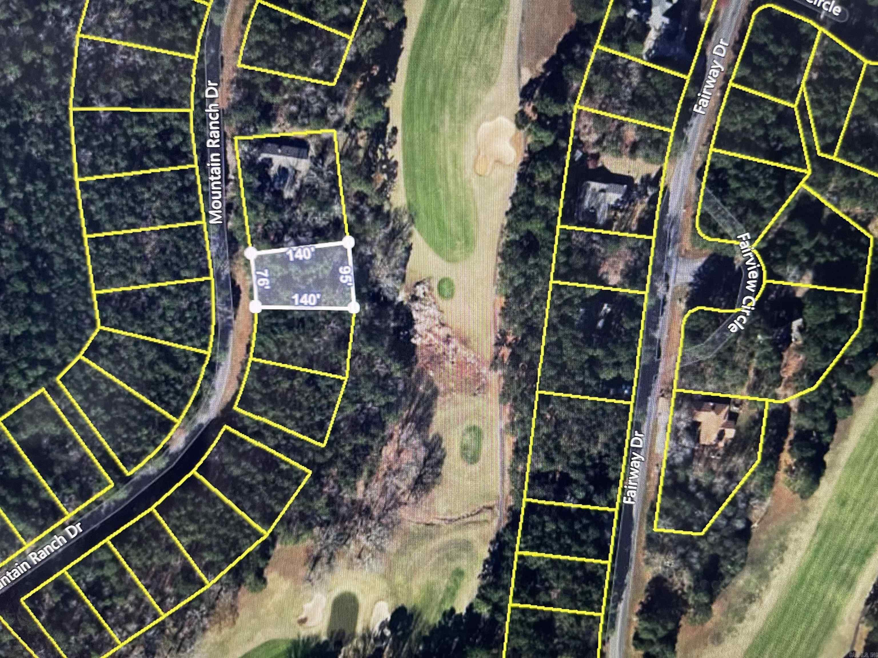 Come build your dream home today on the golf course frontage lot. Enjoy living in Fairfield Bay, where every day feels like a vacation! Nestled amidst the picturesque landscapes of the Mountain Ranch Golf Course, this area offers you the perfect blend of relaxation & adventure. With this prime location, you can indulge in your passion for golf anytime you desire. Tee off during the day & as the sun sets, bask in the breathtaking views of the shimmering lake nearby. This is the epitome of tranquil living at its finest. But that's not all! Fairfield Bay boasts a plethora of amenities to enrich your life. Within minutes of your new abode, you'll find a full-service marina, beckoning you to embark on aquatic adventures whenever the mood strikes. Dive into the refreshing waters of one of the three swimming pools, or challenge your friends to a game of tennis or pickleball. Feel the thrill of exploration as you traverse the hiking & biking trails, or opt for a leisurely round of miniature golf or disc golf. With over 80 miles of UTV trails at your disposal, the possibilities for outdoor recreation are endless. Buyer to pay all closing costs and title insurance.