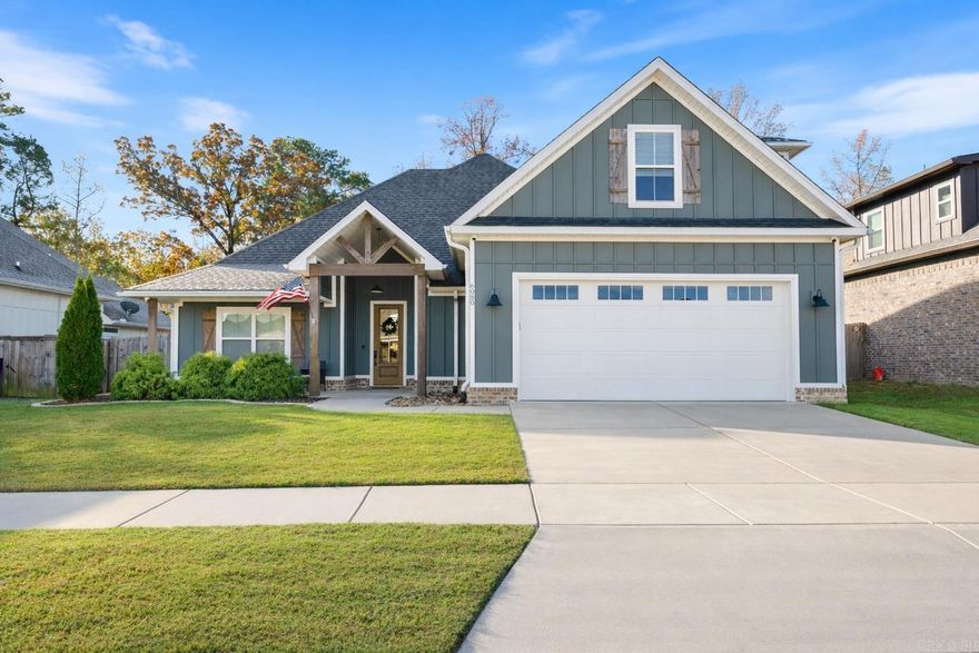 Some homes just feel right from the start. 6080 Meridian Drive is one of those. Thoughtfully crafted by Jody Petty and set in Kensington Place within the Bryant School District, it’s a home built for how people actually live—where craftsmanship meets comfort and every space has a purpose.  The large living room welcomes you in with a brick hearth and built-ins that make gathering easy. The open floor plan centers around a stunning kitchen island and a generous walk-in pantry—plenty of room to cook, create, and connect. The dining nook overlooks a private backyard that backs up to open land, offering peace, privacy, and the kind of view that makes you exhale.  The split layout keeps the primary suite tucked away, featuring a spa-like bath and a closet that connects directly to the laundry room. A mudroom off the garage adds daily function, while two guest bedrooms sit apart for privacy. Upstairs, a spacious bonus room adapts as a fourth bedroom, playroom, office—or all three.  6080 Meridian Drive is the kind of place where mornings start slow, evenings linger longer, and every room feels made for the moments that matter most.