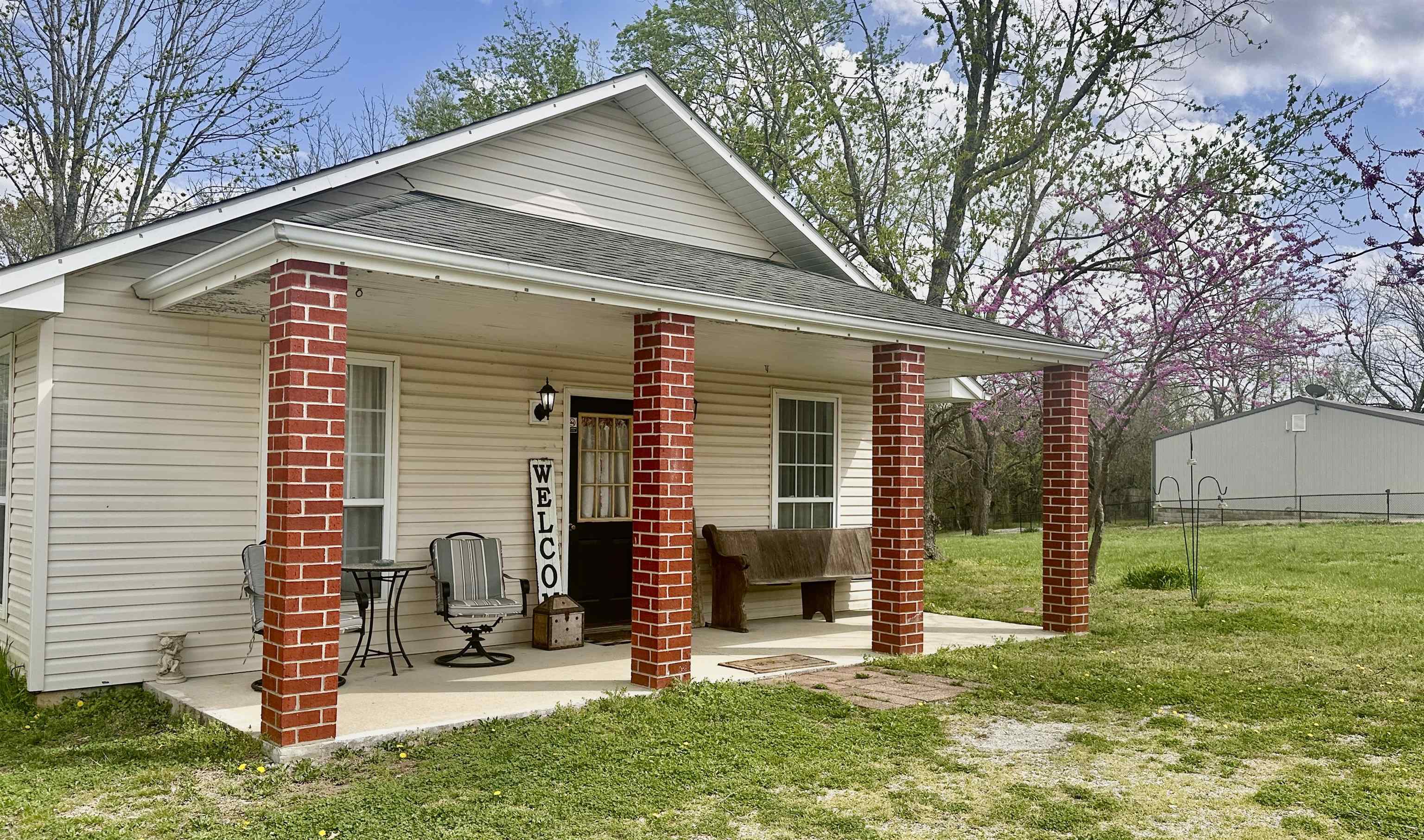 Discover the perfect blend of comfort and convenience in this charming bungalow located at 21 Sharp St., Ash Flat, AR. Built in 1998, this single-family home offers 1,680 square feet of thoughtfully designed living space on a level, partially fenced 1-acre lot. Interior Highlights: Bedrooms & Bathrooms: Three spacious bedrooms and two full bathrooms provide ample accommodation. Living Areas: Enjoy two distinct living spaces, ideal for relaxation and entertainment. Kitchen: The eat-in kitchen features an electric range and dishwasher, perfect for culinary endeavors. Flooring: A harmonious blend of wood and tile flooring enhances the home's aesthetic appeal. Laundry: A dedicated laundry room with washer hookup adds to the home's practicality. Outdoor Features: Deck & Porch: A welcoming porch and a rear deck offer serene spots to enjoy the outdoors. Yard: The partially fenced yard provides a safe haven for pets and outdoor activities. Utilities: Equipped with a central heating and cooling system and a gas water heater for year-round comfort. Additional Highlights: Versatile Use: Currently an active Airbnb, this fully furnished home has been meticulously u
