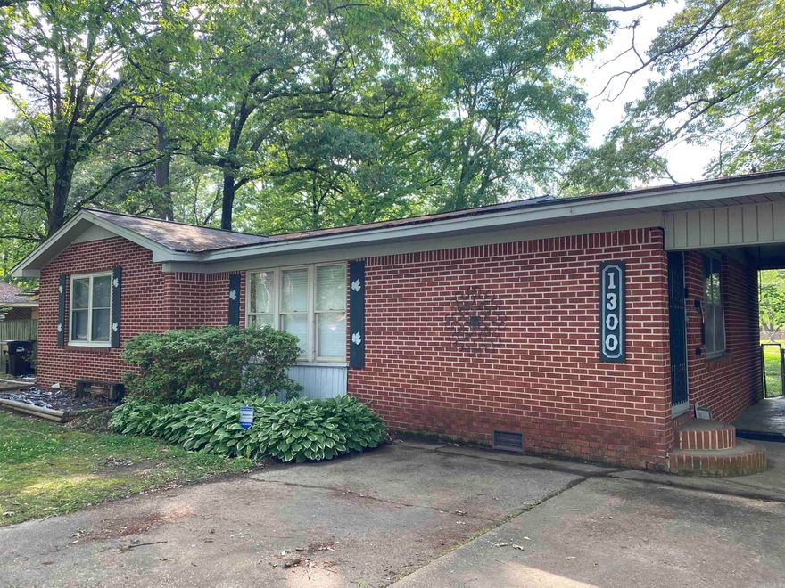 3 bed / 1.5 bath home on 0.63-acre corner lot. Beautiful view of Crossett City Park from the large living room window. Open kitchen/dining with walk-in pantry and build-in desk. Double doors from kitchen open to covered back deck with walkway to storage building. Full bath has shower/tub combo. Half bath also serves as laundry room. Storage room under double carport with shelving and cabinetry.