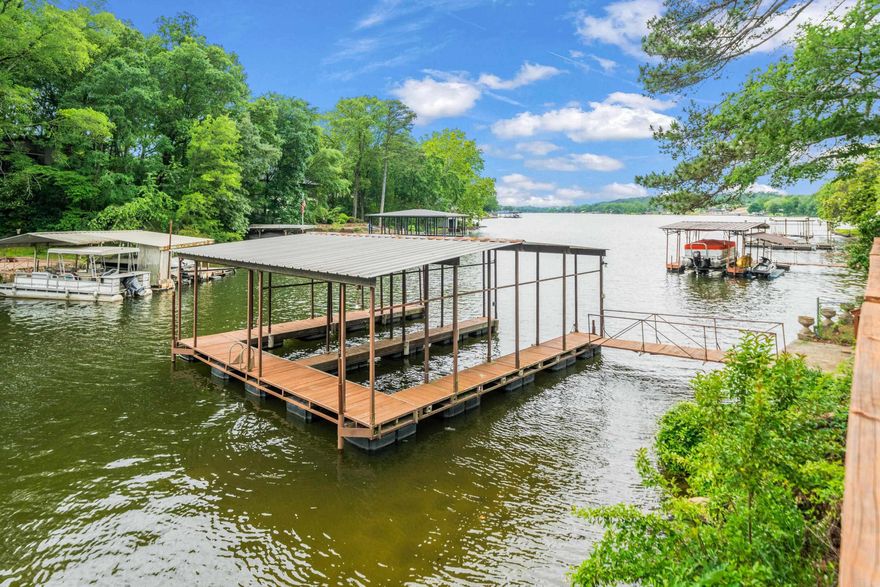 Lovely quiet area of Lake Hamilton, located in a wide cove...Views are stunning--Large outdoor entertaining areas with seawall...2 homes with a covered 2 stall dock are included--possibilities are endless.  Offered by Lake Hamilton Realty, this 2 home residence could be combined or used separately! Would also be perfect for Short Term Rentals! It has beautiful lake views and has a covered 2-stall dock with a seawall--The property has had many high-end renovations, including appliances and an outdoor kitchen...large patio areas surround the property and it has such a charming Lake Presence! Text Listing Agents for showings... Work from home Tenant-occupied, showings must have 24-hour notice and be after 5 pm during weekdays