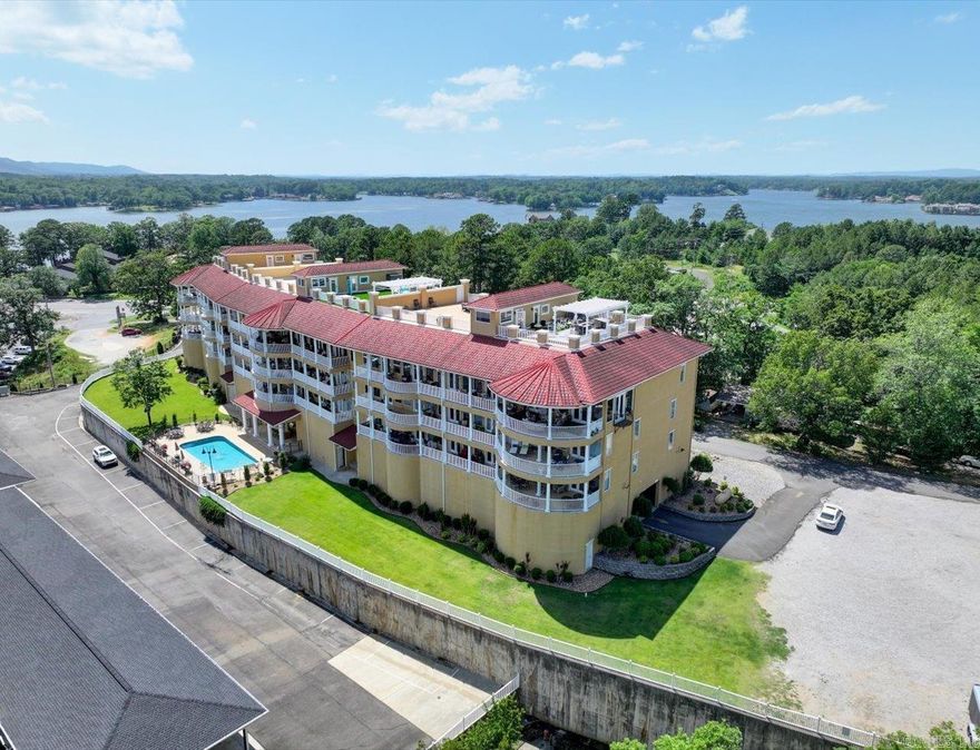 This luxurious lakefront condo on St John's Island offers breathtaking 180-degree views of Lake Hamilton and an unparalleled lifestyle. Wake up to stunning vistas, relax on your private balcony overlooking the shimmering lake, and enjoy easy access to Hot Springs’ vibrant amenities. More than a condo, it’s a statement of refined taste and sophisticated living with indoor and outdoor entertaining spaces.  Natural light floods the space through large windows and a private balcony. High-end finishes include stainless steel appliances, granite countertops, travertine floors, and upscale fixtures. The Private Master Suite features a luxurious bath, walk-in closet with built-in dressing area, and new marble tile. Two oversized bedrooms each have walk-in closets and en-suite baths with upgraded showers.  The penthouse rooftop offers an enclosed private kitchen & bar, guest bath, and a deck with gazebo, multiple seating, dining areas, and 360-degree views. Recent upgrades include a roof replaced two years ago. A large storage unit leased for $75/month may transfer.  Perfect for vacation or full-time living in luxury.  Want me to tweak it more?