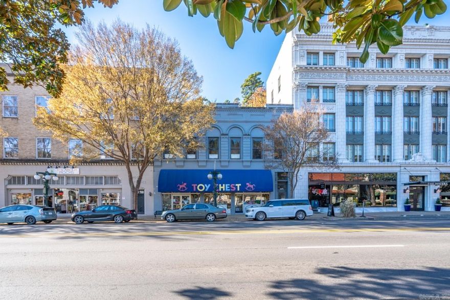 Own your very own piece of Hot Springs rich history. The iconic Toy Chest is retiring and closing the business. Situated next door to The Waters Hotel the architectural details in this grand building is an opportunity to capture the tourism income of the National Park in Historic Downtown and maximize your investment. Featuring 8534sf with 4200sf of ground floor retail space perfect for a new business with large display windows facing the street PLUS the second floor equal in size is a blank canvas for limitless possibilities. Upstairs overlooks Bathhouse Row and the grand lady herself, the Arlington Hotel and all that downtown life has to offer. Original hardwood floors on the second floor with high ceilings and vaulted sky light - and all the history of this building...Oh if those walls could talk! ;) Convert to upscale vacation rentals, professional offices, conference and event center or your own on-site home. No matter your plans - the hustle and bustle in the heart of the Spa City is waiting to welcome you in.