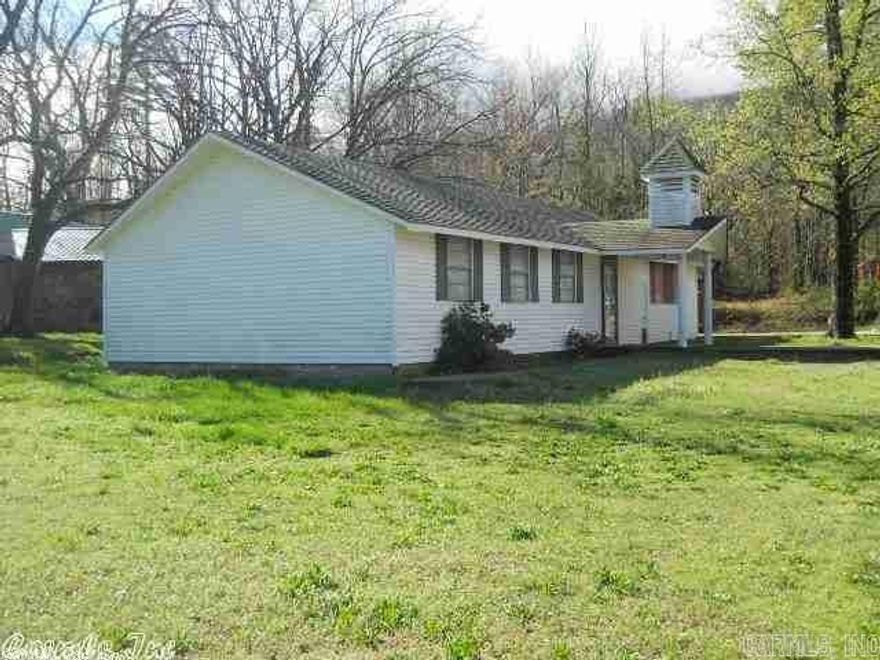 White house has 1 bedroom, 1/2 bath, large country kitchen.  Currently used as recreational/get away place at the foot of Rich Mountain.  Concrete patio, really neat place.