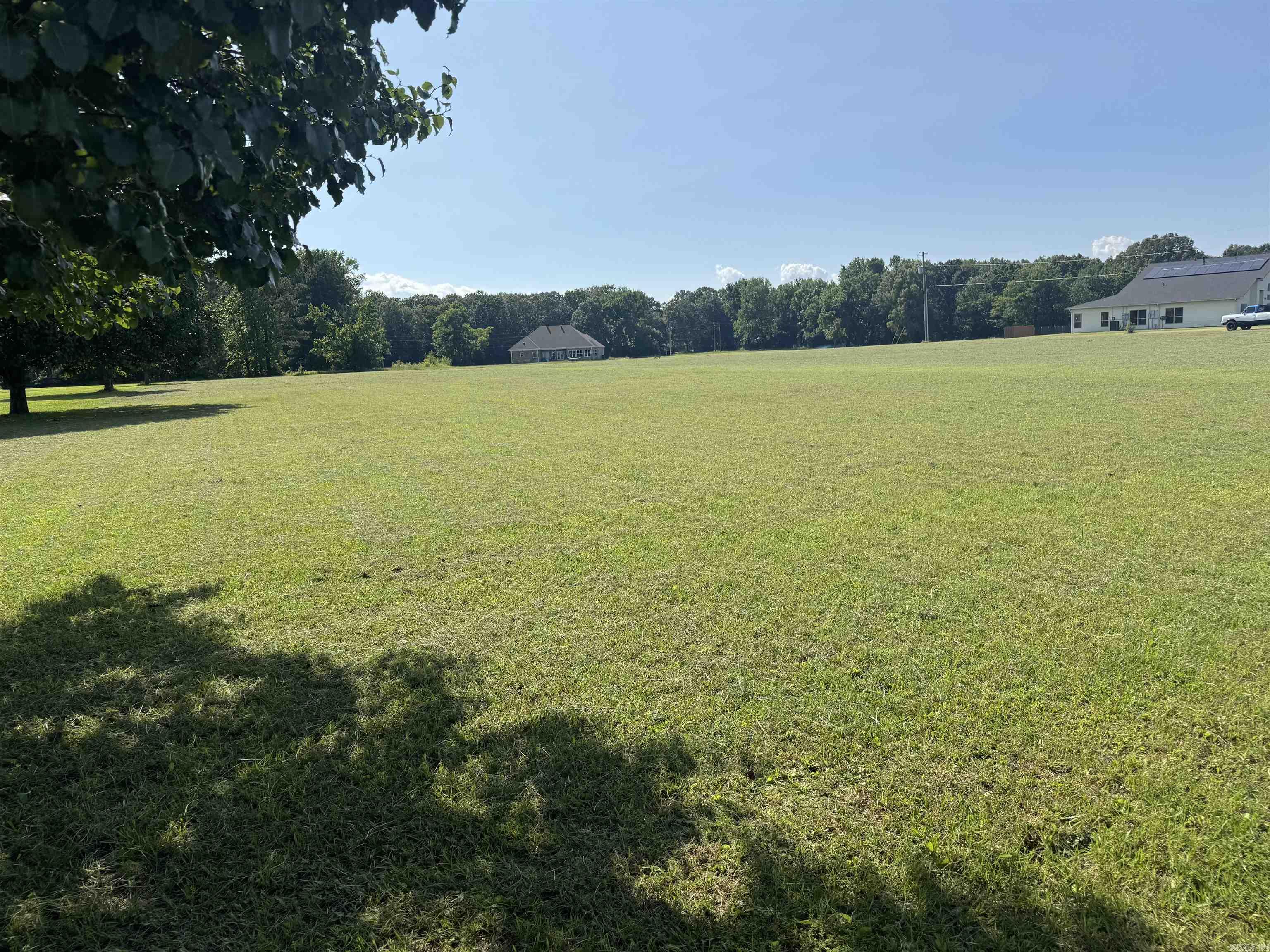 Discover the freedom to build on this cleared, flat 3.01-acre lot nestled in a rural setting. With utilities available at the road and no clearing needed, this is the ideal canvas for your custom home, barndominium, or weekend retreat. Surrounded by established homes on acreage, you'll enjoy privacy without isolation.