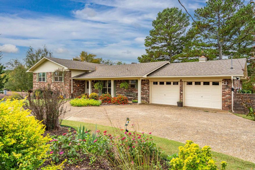 Nestled quietly within the Hot Springs city limits, 104 Talmadge Place offers the rare combination of over 4 acres of land with the comfort and convenience of in-town living. This unique property provides an exceptional opportunity for those seeking privacy, room to expand, and the best of both worlds — peaceful, wooded surroundings just minutes from shopping, dining, and Hot Springs National Park.  As you arrive, you’ll immediately appreciate the property’s generous setting and mature trees that create a natural buffer from neighboring homes. Several out buildings, shops, and barn give you ample storage and work space. Whether you’re envisioning a private retreat, a family compound, or simply a spacious homesite with room to garden, explore, or entertain — this property delivers endless potential.The residence itself features a comfortable layout ideal for everyday living, with warm, inviting spaces ready for your personal touch. Large windows invite in natural light and capture the serene views of the surrounding landscape. Step outside and enjoy the expansive acreage — a perfect backdrop for outdoor gatherings, a hobby farm, or future development possibilities.