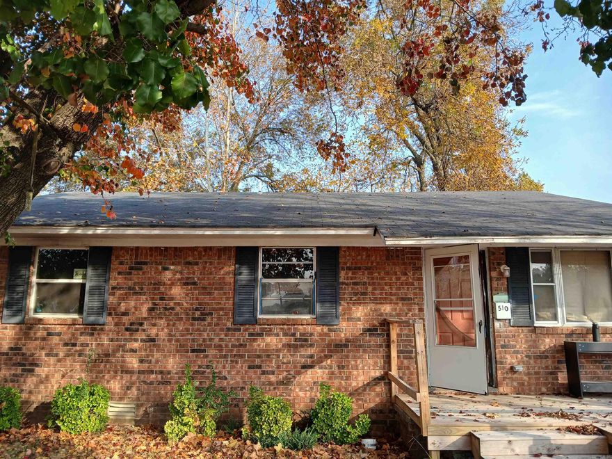 Charming 3 Bedroom Brick Home with Great Potential!  This 3 bed, 2 bath 1,640 sq. ft. brick home offers a solid foundation and an excellent location—just minutes from the middle school, shopping, and everyday conveniences. With some interior renovation and updating needed, this property is perfect for investors, DIY enthusiasts, or anyone looking to customize a home to their taste.  Enjoy a large covered back deck, ideal for relaxing or entertaining, overlooking a partially fenced yard that provides ample space for pets, gardening, or outdoor activities.  With its great layout, strong structure, and unbeatable proximity to local amenities, this home is a fantastic opportunity to add value and make it truly your own.