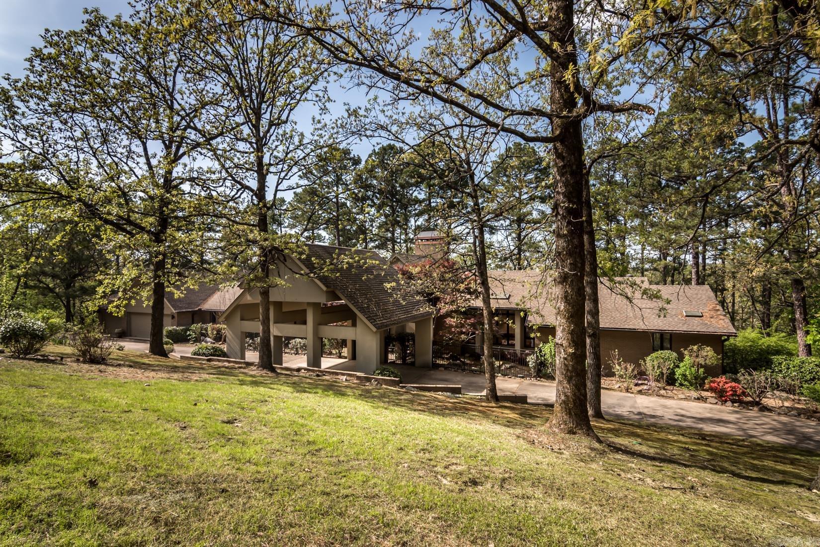 Welcome to your secluded haven nestled within the picturesque landscape of Pleasant Valley, boasting an expansive 9.26-acre estate. Tucked away in the heart of West Little Rock, this property offers unparalleled privacy and tranquility amidst the bustling city life. Architecturally significant, this residence showcases a stunning soft contemporary design that seamlessly integrates modern sophistication with timeless elegance. Every detail reflects meticulous craftsmanship and thoughtful attention to aesthetics, resulting in a home that exudes both style and comfort. Custom-built by a renowned builder in the Little Rock community, this estate epitomizes quality and distinction. Whether you're lounging in the sun-drenched living areas, preparing gourmet meals in the chef's kitchen, or retreating to the serene master suite, every corner of this home offers a sanctuary of serenity and sophistication. With its unbeatable combination of privacy, luxury, and architectural significance, this Pleasant Valley estate offers a rare opportunity to experience the ultimate in refined living in the heart of West Little Rock.