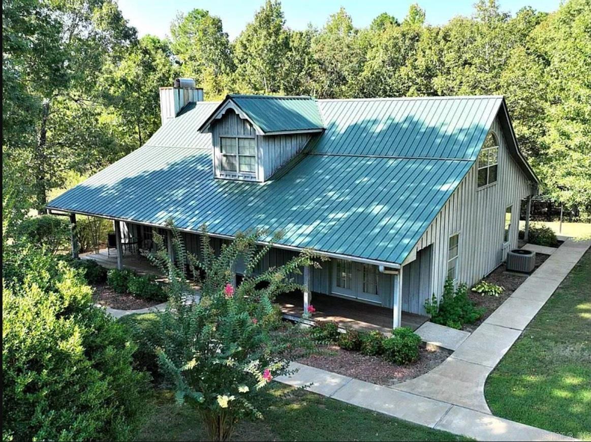 National Forest boundary on North line. Wooded, some pasture. Guest house with bath (completely renovated in 2015). 30 x 40' shop. 2 car garage (20x25'). HVAC system replaced in 2019. Beautiful setting, secluded, and at the end of the lane. One owner. House, cabin, and garage are 2X6, 16" OC construction Cypress Board & Batten siding home. 2 bedrooms, 2.5 baths. Office. Vaulted ceiling, cove lighting, wood ceiling. Covered porches. Metal roof in 2013. 2 water wells on property one for home and one for pasture/garden. Well maintained. Purchased with additional acreage