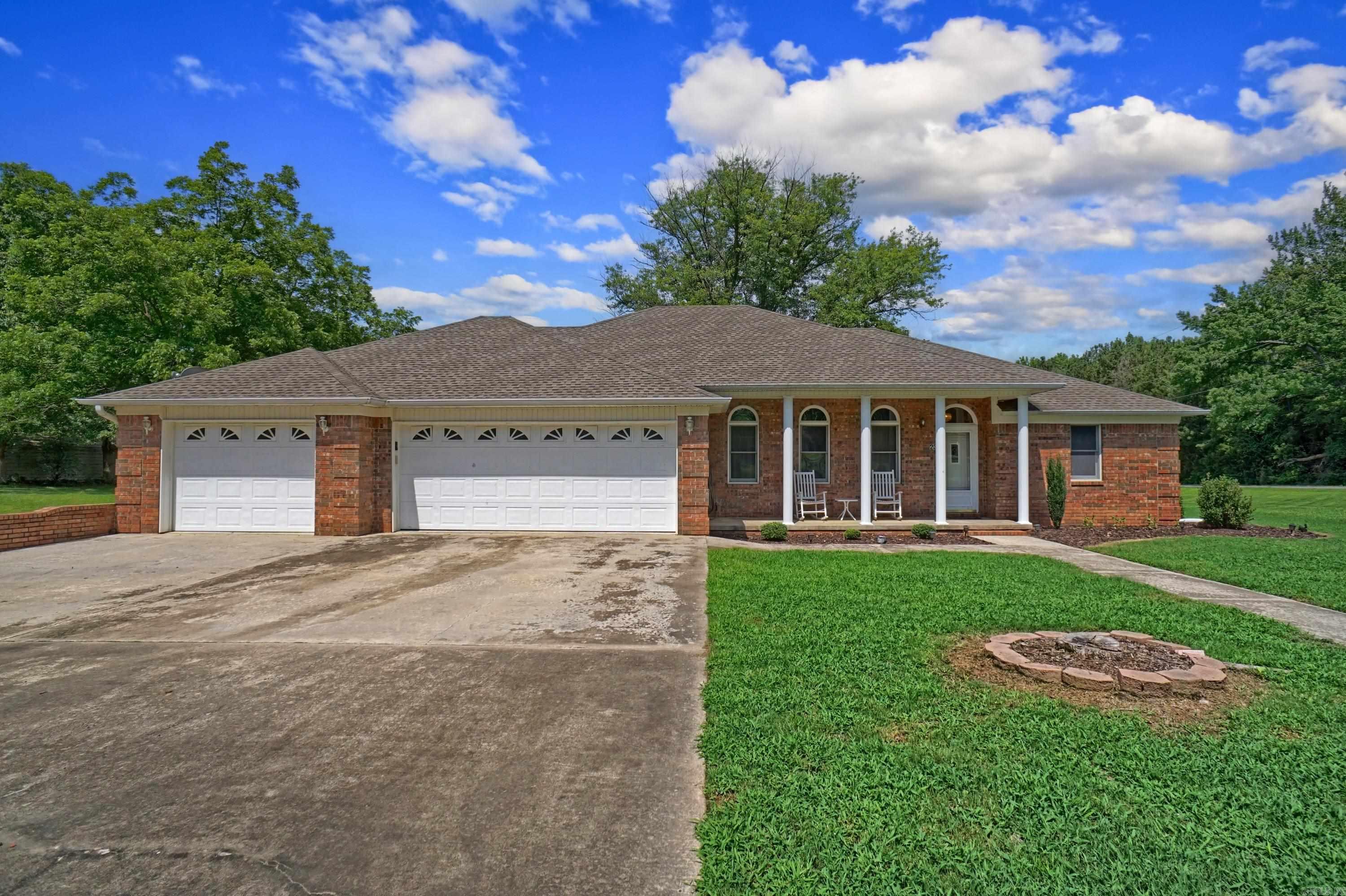 Welcome to 23 Fisher Lane—a spacious 2,537 SF brick home situated on 1.5 (+/-) serene acres just off Morgan Road, offering the perfect blend of country charm and convenience to both Dover and Russellville. This unique property features a flexible and functional layout that adapts effortlessly to your lifestyle. With three full bathrooms and three bedrooms—including a main suite that boasts two private baths (one with a walk-in shower, the other with a relaxing soaking tub)—everyone gets their own space to unwind. Need even more room? The additional bonus space is ideal for a fourth bedroom, home office, playroom, or creative studio. The layout offers endless possibilities, whether you're entertaining, working from home, or just need space to spread out. If you’re looking for comfort, versatility, and a peaceful setting within minutes of town, 23 Fisher Lane is ready to welcome you home.