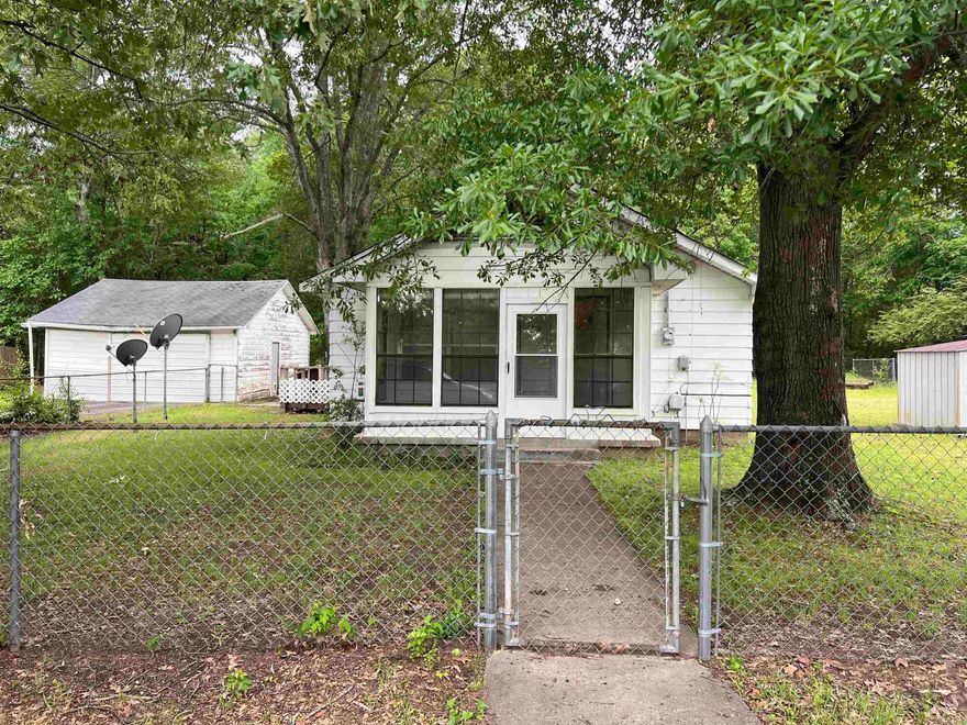 Great Fixer-Upper Opportunity! This 3-bedroom, 1.5-bath home is full of potential and waiting for your personal touch. Situated on a spacious, partially fenced lot, there's plenty of room for outdoor activities, gardening, or future expansion. Inside, you'll find a dedicated laundry room for added convenience and a cozy sunroom with a window unit—perfect for relaxing or transforming into a home office or hobby space. The home features central HVAC to keep you comfortable year-round, and the roof has been recently updated, giving you one less thing to worry about. A detached carport provides covered parking or extra storage. Whether you're a first-time homebuyer looking for a place to make your own or an investor seeking your next project, this property offers excellent value and tons of potential.