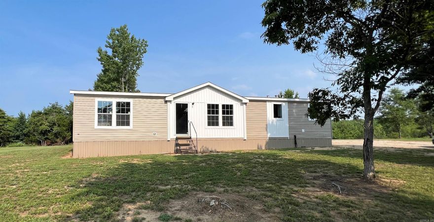 This new manufactured home has a beautiful view sitting on 8 acres! They have put a permanent foundation under this 1,620 sq ft home with 3 bedrooms & 2 bathrooms. The kitchen has all the appliances, still under warranty along with a lot of storage and breakfast bar. The master bathroom has a large walk-in shower along with a soaking tub, and double sinks. This home and land are a must see!!  Give me a call and let's go take a look.