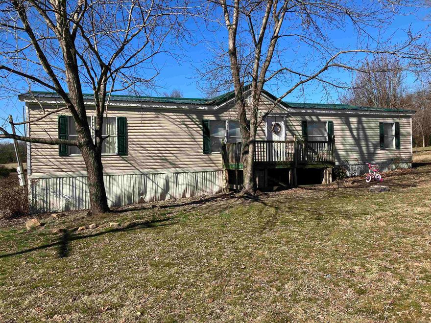 Lucrative Investment Property with Tenant in Place!  Don't miss this spacious manufactured home situated on an extra-large city lot—a perfect opportunity for investors or those looking for a versatile home.  Generous Kitchen Layout -featuring ample cabinetry, a convenient breakfast bar, and a cozy eat-in dining area.  Flexible Living Spaces includes an extra room, ideal for an office or to suit your specific needs.  Spacious Master Suite - the master bedroom boasts a private, generously sized bathroom, offering comfort and privacy.  A charming fireplace insert adds warmth and comfort during chilly days.  With a tenant already in place, this property is an excellent income opportunity. Call today to schedule your showing before this gem is gone!