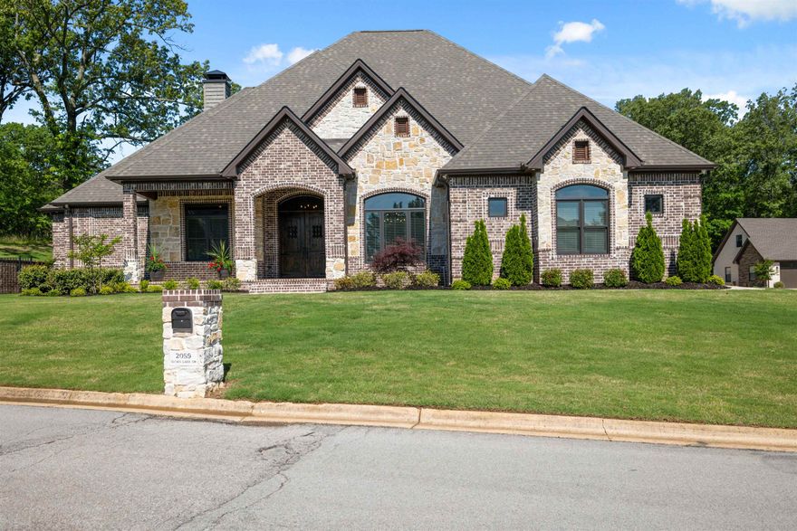 Welcome to beautiful Sloan Lake Estates!  This stunning custom home features 4-5 bedrooms, 3.5 baths, beautiful family room with 20' stone wood burning fireplace.  The family room features beautiful Amish timber trusses and opens to a large covered rear porch featuring the Amish timber trusses as well.   The family room and covered back porch are separated by a 15' bi-folding glass door creating a wonderful opportunity for entertaining guests.  Spacious primary suite is located on the main level which includes separate walk-in closets with one also a safe room. Primary bath includes plenty of cabinetry, large shower and free-standing tub.  Bedrooms 2 & 3 also located on the main level. The upper level includes bedroom 4, along with nice sized room used as a 5th bedroom, large second living area, and full bath.   The home features 10' ceilings throughout, 8' solid interior doors with Emtek hardware, Generac generator, and camera/alarm system.  The spacious chef's kitchen includes beautiful cabinetry, large island bar, built-in refrigerator/freezer, gas cooktop, double ovens, and large pantry with built-ins.   Quality is evident throughout this wonderful home!