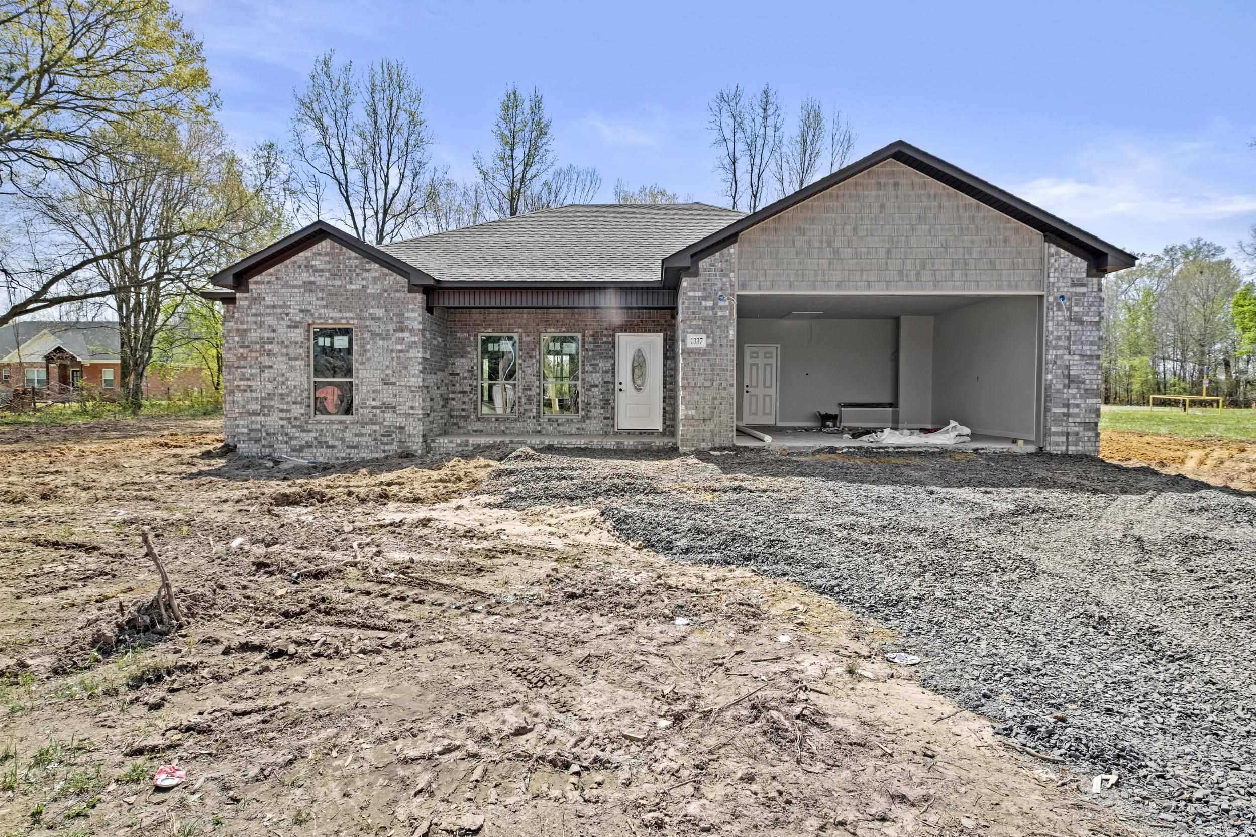 Country living with city convenience! Discover the perfect blend of tranquility and accessibility with this stunning new construction all-brick home, ideally situated for those who cherish the peace of country living yet desire the conveniences of the city. This spacious home offers 4 bedrooms and 2 baths, providing ample space for family and guests. The island kitchen is a chef's dream, featuring granite countertops, painted cabinets, a charming farm sink, and a stylish backsplash. You'll also love the abundance of storage space, perfect for stocking up your pantry. Enjoy the spa-like walk-in tile shower and double vanities, offering a touch of elegance and functionality. Equipped with cabinets, the convenient laundry room provides both convenience and additional storage. Experience the beauty and durability of luxury vinyl flooring throughout the home ā no carpet, ensuring low maintenance and a modern look. Please note that this home is currently under construction, allowing you the opportunity to envision your future in this beautiful space. Embrace the best of both worlds with this exceptional property that promises a lifestyle of comfort and convenience. Make it yours today!