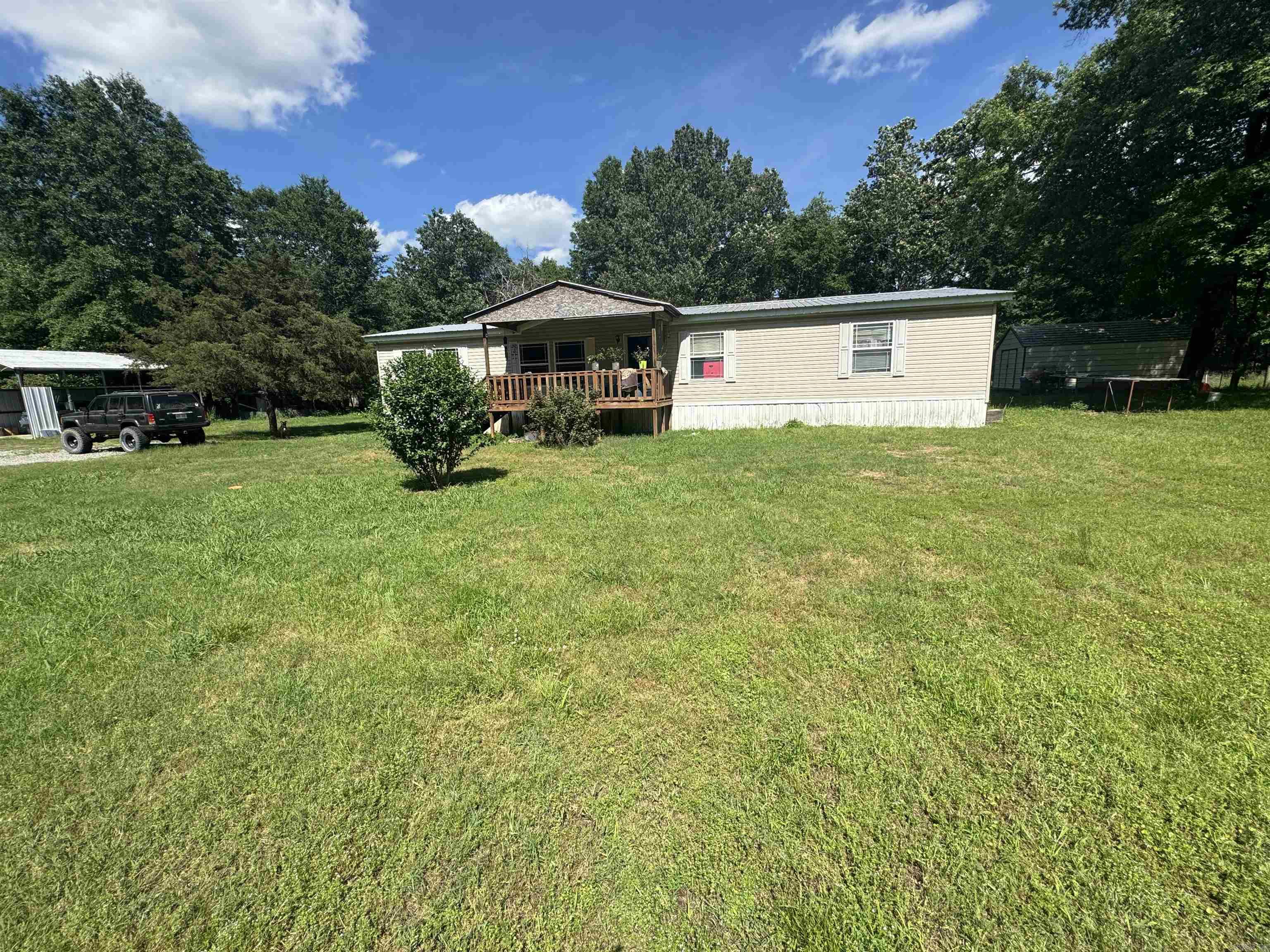 Looking for a piece of the country life, look no further than 15 Keeton Cove!! This 4 bed 3 bath mobile sits on almost 5 acres in beautiful rural Faulkner County and is waiting for you to make it your own! The home sits off of the road about 400 yards surrounded by mature trees and provides plenty of privacy and seclusion while only being 20 minutes from Conway, 10 minutes from Vilonia, and 15 minutes from Greenbrier! Fully fenced with barb wire and no restrictions so bring on the animals! Schedule your private showing today!