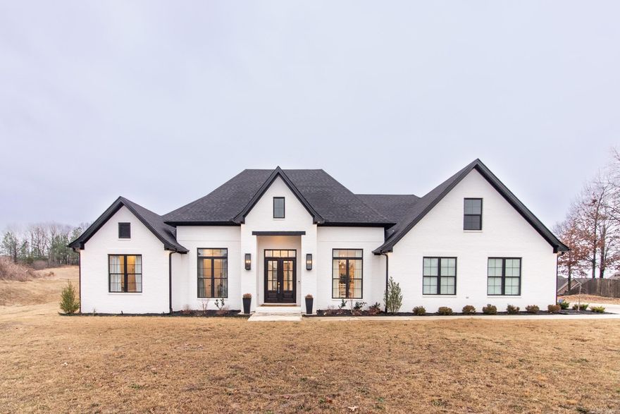 Discover comfort and elegance in this exquisite 4-bedroom, 3-bath home in Jamestown Manor. The wide-open floor plan creates spacious living spaces, highlighted by a luxurious kitchen with a huge central island, gas range, and so much more. A vaulted ceiling creates an airy ambiance throughout.   You'll love the spacious bedrooms, each with walk-in closets to provide ample storage. The unfinished bonus room, thoughtfully plumbed for a full bath, presents endless possibilities for customization, allowing you to tailor the space to your needs and preferences.  Whether you're entertaining guests in the formal dining area, unwinding in the soaker tub, or enjoying the fresh air on the covered patio, you can embrace the lifestyle of luxury at 2211 Addison Cove.