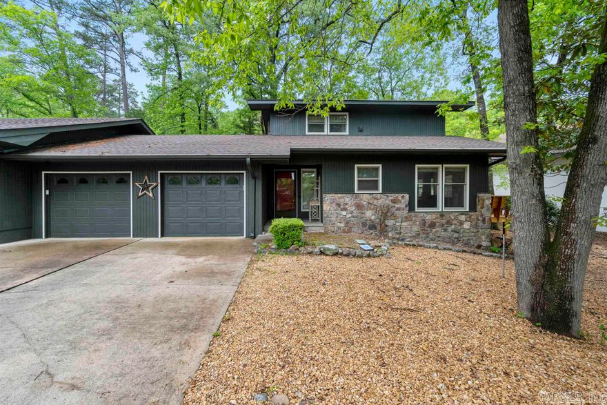 This end-unit townhome has numerous new amenities AND a view of Lake DeSoto! It also has features that the surrounding townhomes don’t have.  Starting with the new windows downstairs which opens up the view of the lake & brighten up the rooms with natural light. This townhome also has a rare, oversized single-car garage with a large storage room for those kayaks, bikes or holiday decor.  Add the space of the new outside wood deck area for enjoying some sun, an indoor sunroom, back area patio AND an upstairs covered deck…you will have a hard time deciding where to enjoy yourself.  The primary bedroom is downstairs, with a fireplace for those cold nights.  The primary full bath serves as the downstairs bath & is accessible from both the bedroom & hallway. Upstairs are 2 generously sized bedrooms and a covered open deck, accessible from either bedroom.  The upstairs bathroom was recently updated with a new tile shower.  The washer/dryer are also located upstairs, making laundry easy.  Note, the enclosed sunroom is not included in the sq.footage above.  This place would make a great VRBO-Airbnb rental or even a long term rental.  Great neighborhood.   AGENTS see remarks.