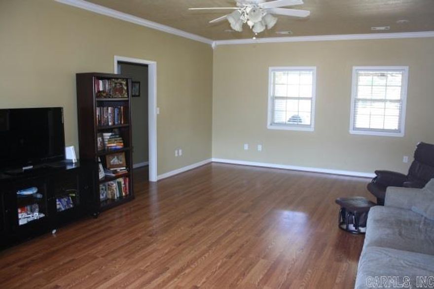 With lots of upgrades, this home features updated lighting; oil rubbed bronze faucets & door hardware; Granite countertops & undermt sink. New range, dishwasher & under-cabinet lighting. Tall ceiling w/ extra trims & crowns in the living & separate formal dining. New laminate flooring in Living room. Oversized bedrooms w/ sitting area in Master. Dual walk-in master closets w/ jetted tub & separate step-in shower. Covered back porch w/ extended patio in the privacy fenced backyard. Extra landscaping