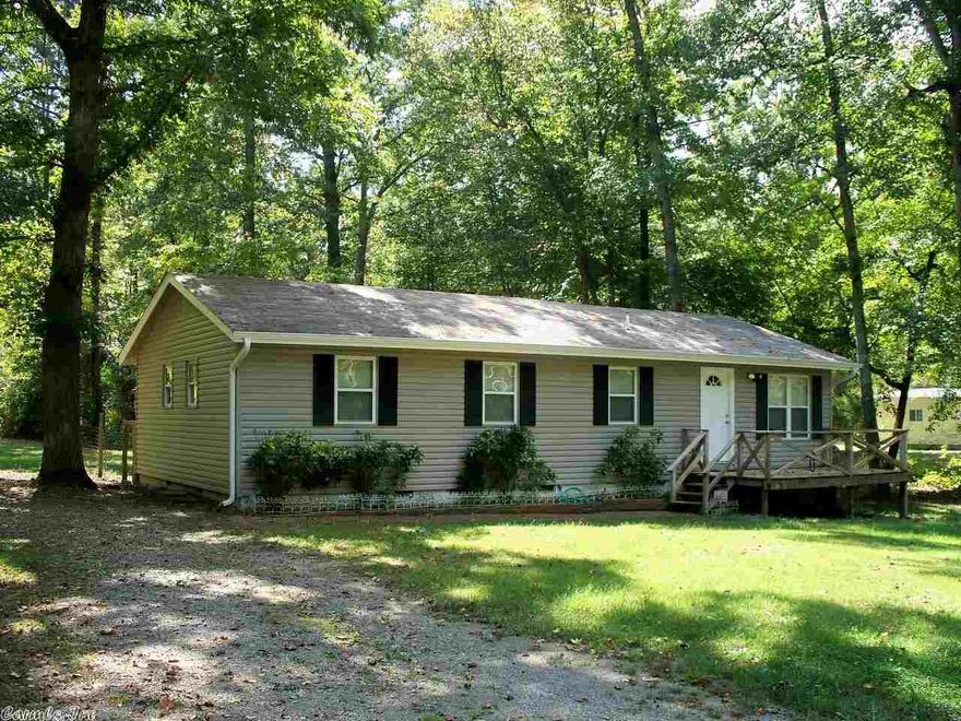 Cute country home.  This 3 bedroom 2 bath home situated on an acre of land in Fountain Lake school district is move in ready.  Updates include:  fresh paint, fixtures, windows, siding, gutters, new hot water heater, carpet, wiring, and appliances.  Nice shaded acre with fenced back yard.