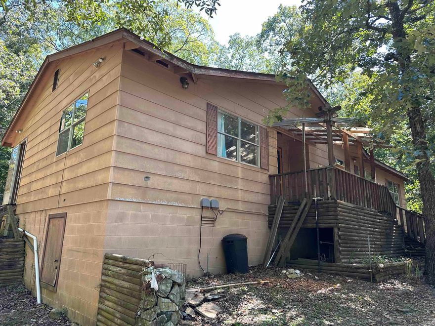 Looking for a peaceful private place to call home? This fixer upper has a lot of potential. Off the main road with over 2 acres but still only minutes from town. With a little TLC this could be a great investment.