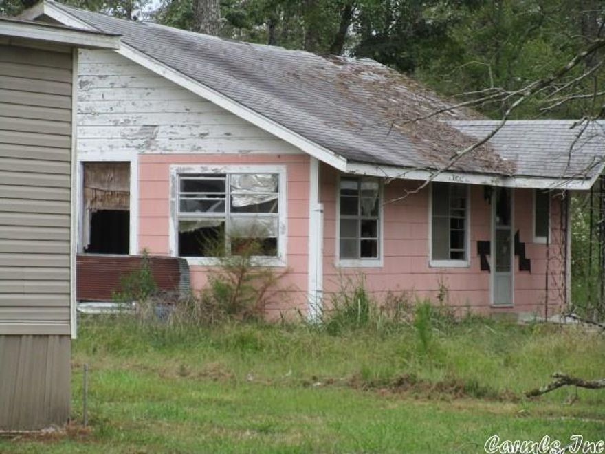 Home and mobile home on property.  Being sold "AS IS".