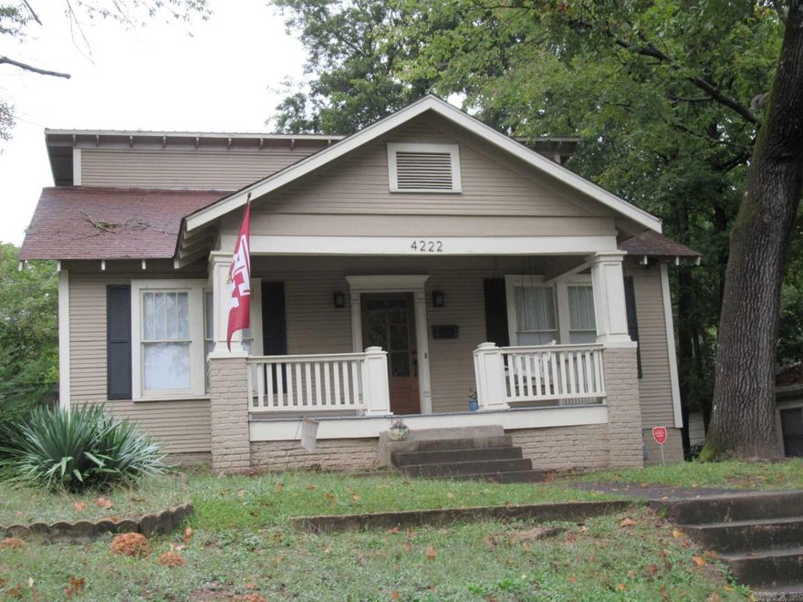 Charming Hillcrest Craftsman home near UAMS, Pulaski Heights Schools, Hillcrest shops & restaurants.  The home has hardwood flooring and spacious kitchen.  Living room features the Hillcrest famous brick fireplace with built in shelving.  Vintage French doors open into a large dining room.  Two bedrooms & bath on main level, master BR or 2 kids BRs up.  A 2nd bath upstairs could be easily added.  Driveway parks up to three cars & on street parking in front of house.  Private backyard.  Inviting front porch.