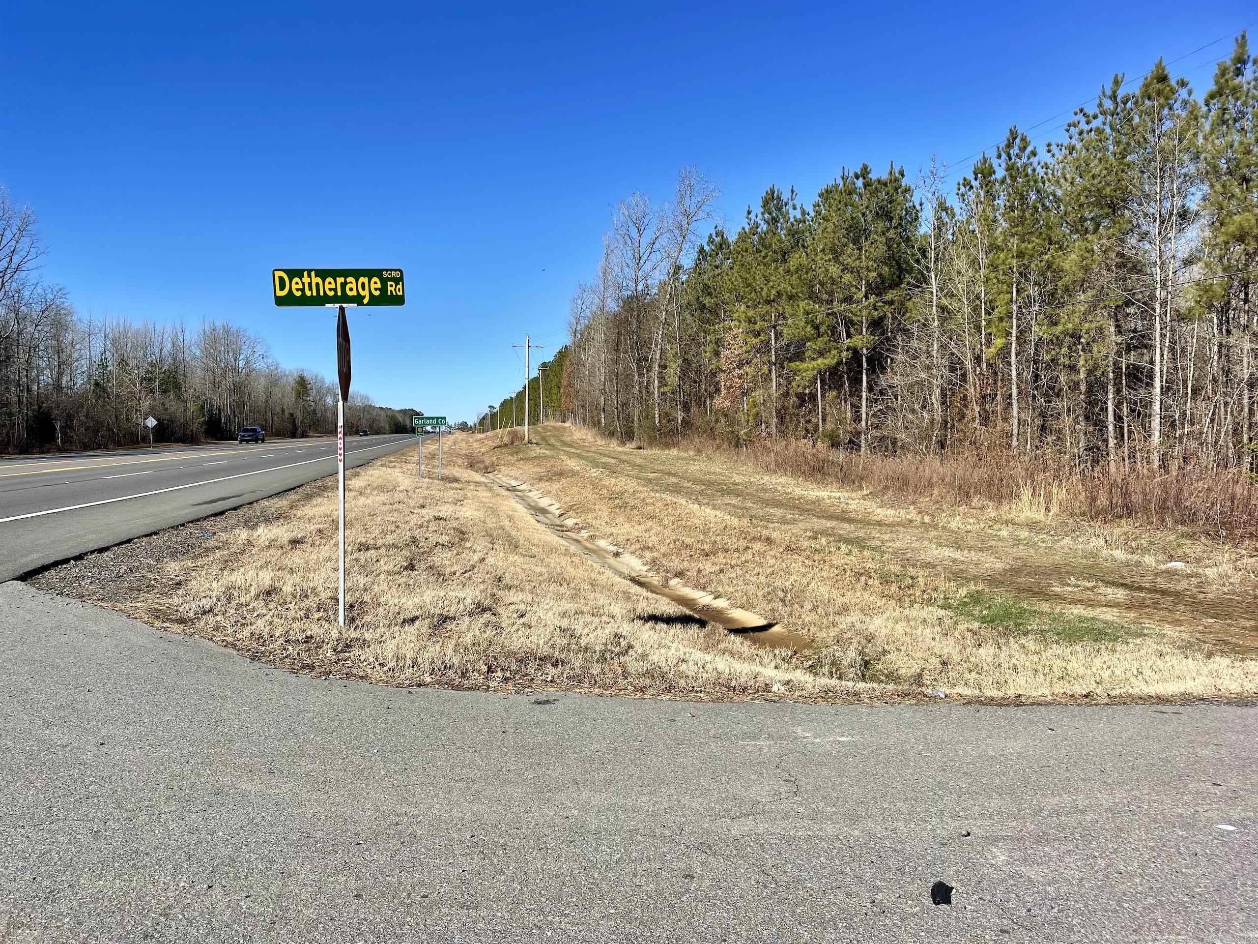 Located on a rapidly developing highway situated between Hot Springs and Benton across from the junction of HWY 70 and HWY 88 this is a great investment property. Gently rolling terrain with an 18-year-old pine plantation that is ready to thin adds to the investment opportunities! With approximately 1/2 mile of highway frontage on the south side of the property and nearly 1/2 mile of paved county road frontage on the east side of the property, developing this into smaller parcels could easily be done. A small creek runs diagonally across the property adding to the desirable features. The property is currently used for timber production and hunting with several roads and trails throughout providing access to the entire property. Minerals convey.