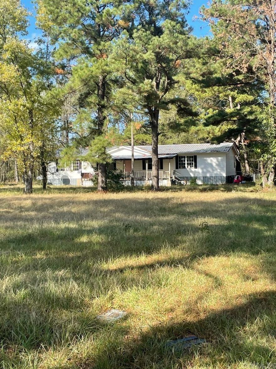 Nestled just off Hwy 32 W near Richmond on approx 2 acres, 3 bedroom 2 baths, newly painted throughout, new flooring in bathrooms!  Large dining space, also formal dining.  Extra large kitchen!  Lots of cabinets!  Large wooden deck the length of the home in the back.  Fenced in yard.