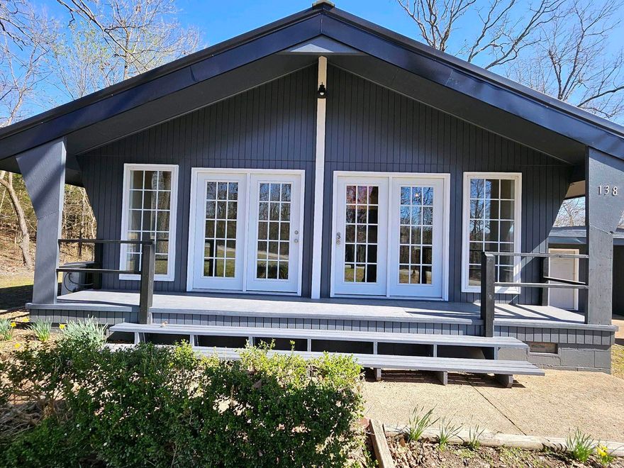 This home has been totally remodeled!! All new kitchen with cabinets, appliances, counters, all new interior and exterior paint, new deck, flooring, sinks, light fixtures. Not doubt it is a move in ready home.   The extra building will not remain with the prop