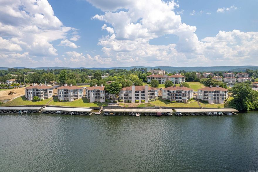 Nestled in the highly sought after 7 South location, this stunning 2 bedroom, 2 bath condo offers breathtaking main channel views and your own personal covered boat slip. Enjoy resort style amenities including a pool, hot tub, tennis courts, and convenient boat trailer parking. With the flexibility of short term rentals and the allure of being beyond city limits, this property offers an idyllic blend of relaxation and investment potential. Selling fully furnished with all appliances and contents. Call today!