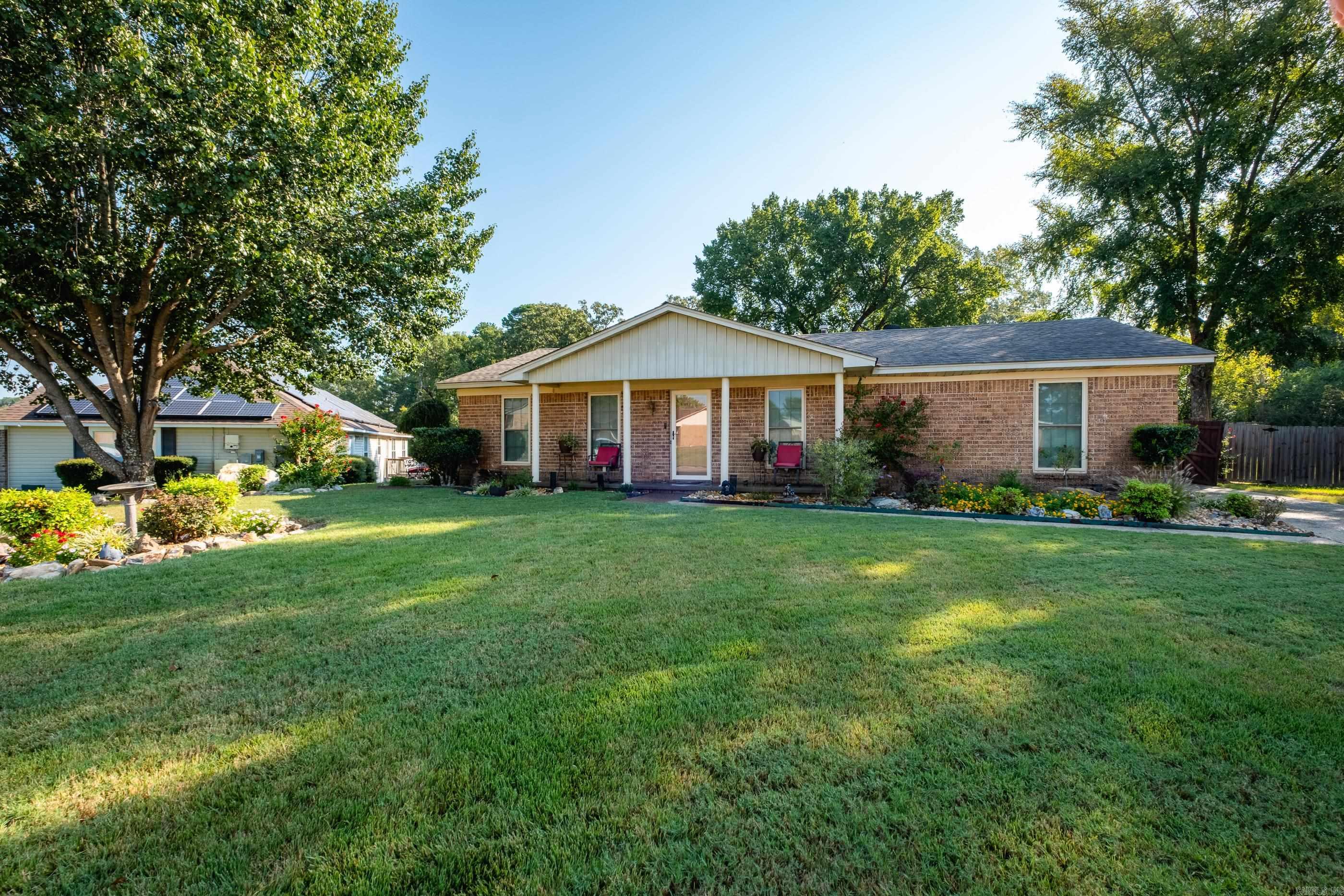 An oasis in a wonderful neighborhood. The landscaping at this home is simply outstanding. The backyard is an inviting quiet retreat from the problems of today. The home features 3 bedrooms, 2 baths that have both been updated, tile and lvt flooring throughout the home, a cozy sunroom just right for that morning cup of coffee and so much more. Agents please check Agent Remarks