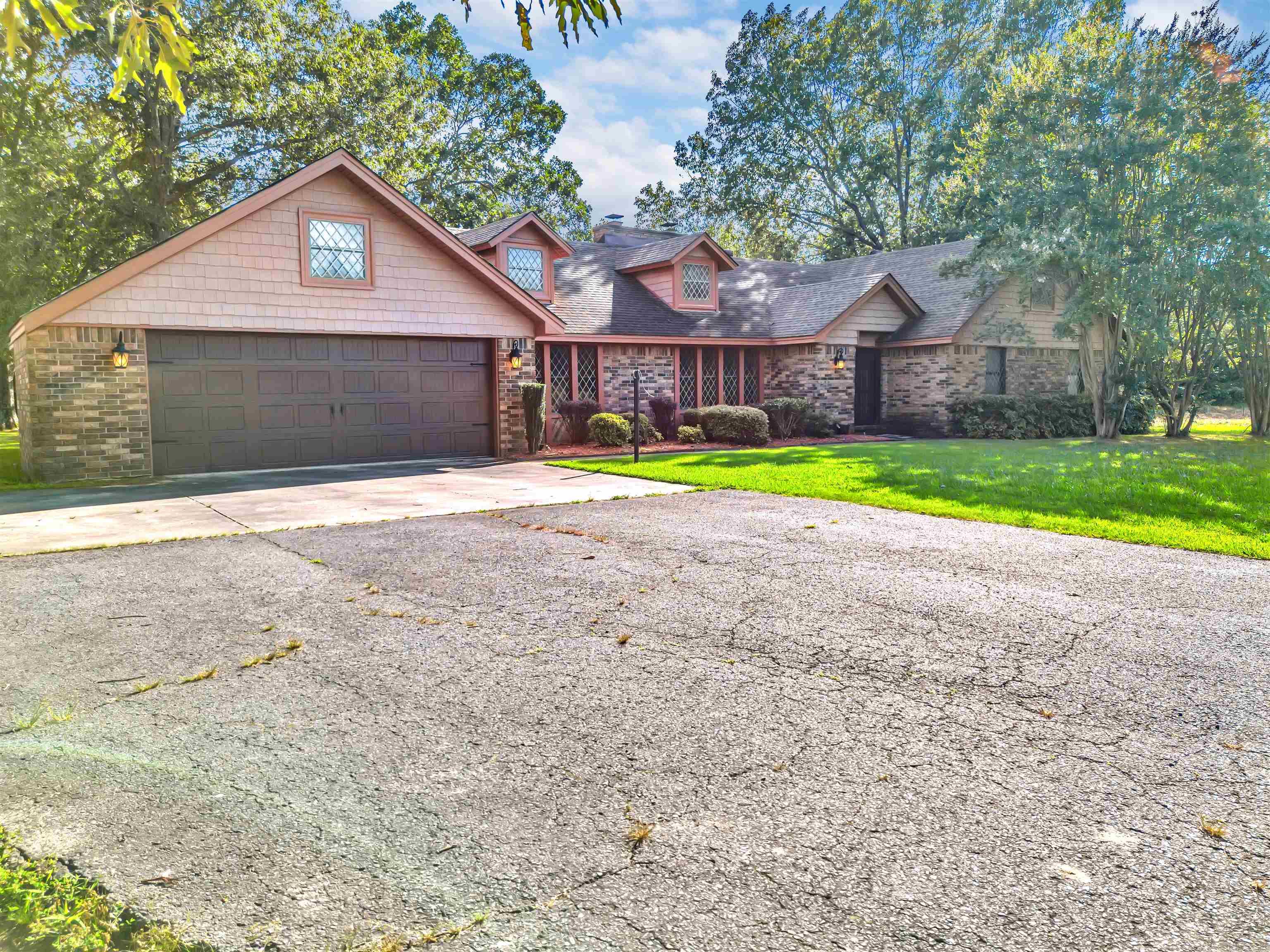 Spacious 4 bed, 2.5 bath home sitting on nearly an acre just outside city limits! With 2,514 sqft, this home features two living areas, a formal dining room, and plenty of room to spread out. Enjoy the peace of country-style living with quick access to the interstate, shopping, and restaurants nearby! ** see agent remarks**
