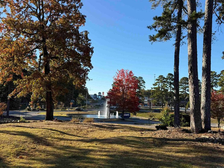 Prime commercial opportunity at the West Gate of Hot Springs Village! This highly visible property is perfectly positioned at one of the community’s most traveled entrances—where the original Cooper Sales Offices were located. Featuring level building sites with utilities to the property, this location is ready for immediate development. A paved road and existing parking area are already in place, offering excellent accessibility and convenience for clients, guests, or future tenants. With its commanding exposure to daily traffic entering and exiting the Village, this parcel is ideal for professional offices, retail, medical, hospitality, or mixed-use development. Surrounded by established businesses, golf, and residential neighborhoods, it provides the perfect setting for your next commercial venture. Premier location, easy access, and endless potential—this is the gateway to success in Hot Springs Village!