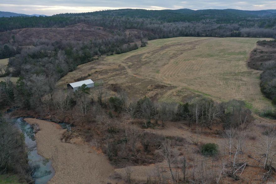 • 101+/- Acres • County Road Frontage • National Forest Boundary • Year-Round Creek • Power • Rural Water • Fiberoptic Internet • Hilltop building site • 40’x60’ Hay Barn • 40’x70’ Hay Barn • Deer and Turkey • Harwood timber • Thick Bedding areas • Hay Meadows • Fourche La Fave River less than 2 miles away • 30 Minutes to Waldron • 55 Minutes to Mena • 50 Minutes to Mount Ida