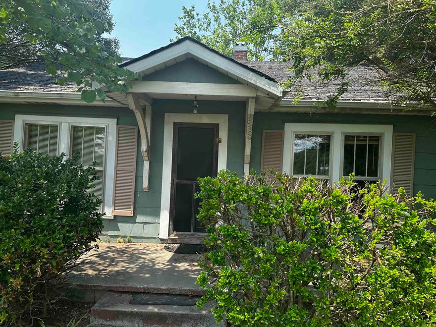 property is deep rather than wide  it consists of an older 1474 sq ft house and a much new 1,200 square ft shop with 5 YR. roof & utilities.