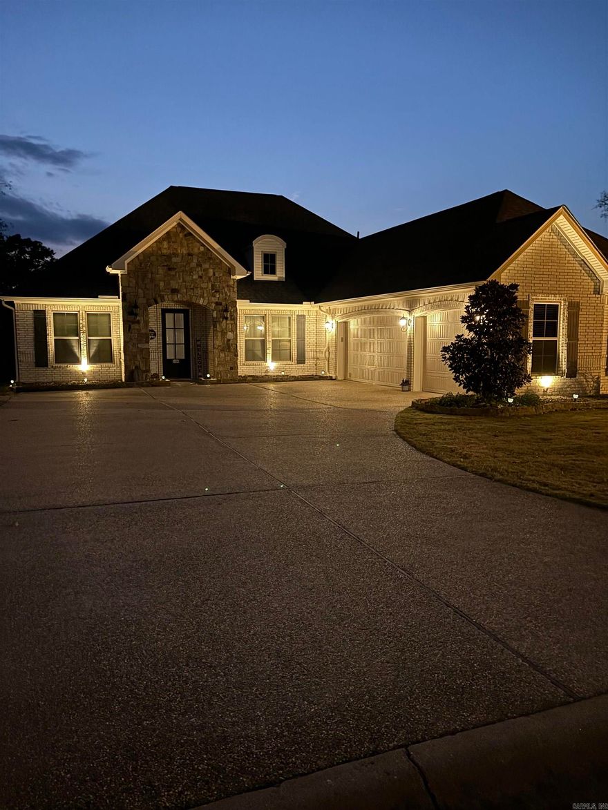 Carriage Custom Home! Welcome to 135 Callaway Circle, a beautiful 3BR/2BA home in Hot Springs' desirable Glencairn neighborhood. With 2,088 sq ft on a .38-acre lot, this home features an open floor plan, elegant white brick and stone exterior, and a 3-car side-load garage. Inside, enjoy a chef’s kitchen with gas cooktop, double ovens, island, walk-in pantry, and breakfast nook. The spacious primary suite includes a spa-like bath and walk-in closet with direct laundry access. Recent upgrades include a 2023 architectural roof and gutters, plus energy-efficient features like a tankless water heater and in-ground sprinkler system. Relax on the covered patio in the fully fenced backyard lined with magnolia trees. Glencairn offers walking paths, ponds, and a welcoming entrance—plus no rentals allowed, preserving its peaceful charm. Don’t miss your chance to call this stunning home yours!  Check on the POA website -- www.glencarin.vinteumneigbrs.com