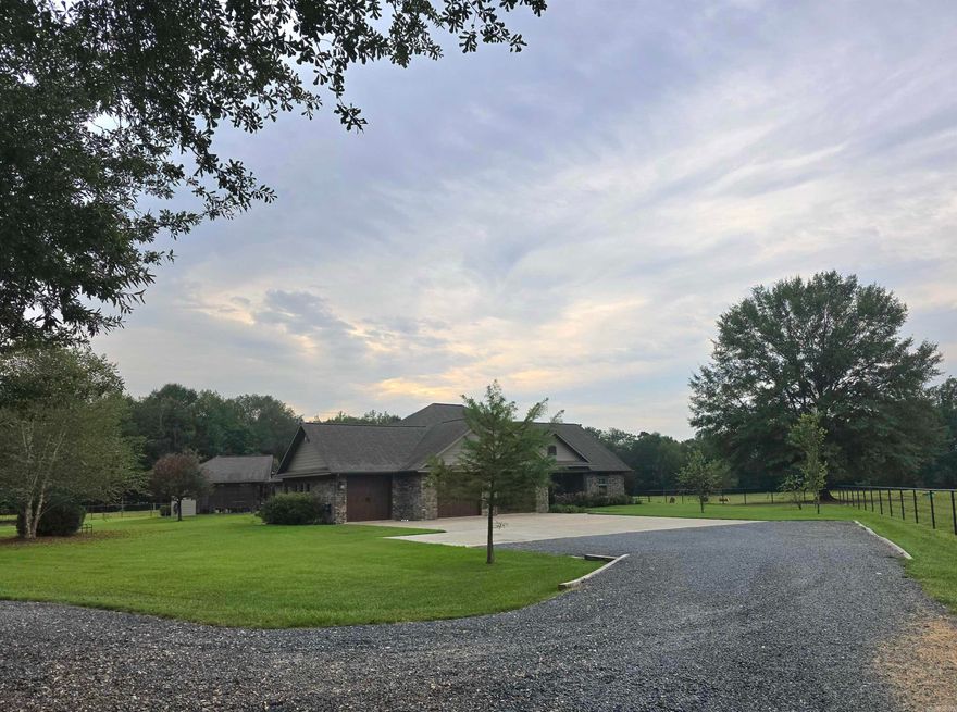 CUSTOM BUILT. 3 bedroom, 2.5 bath with approx. 3334 Sq. Ft. of living space.  Office could be 4th bedroom.  Custom Hickory cabinets with soft close, built/installed by Pender Craft Cabinets throughout house with Quartz countertops.  Also, an entertainment center in the living room by Pender Craft Cabinets.  Crown molding and 6-inch base board throughout.  Finished garage with 3 bays, insulated doors with heavy-duty openers, heated & Cooled.  Lennox 3 zone heat pump, whole house generator system.  Nine station lawn sprinker system.  Oversized Cast Iron Clawfoot tub and large shower.  Huge walk in Master closet with custom shelving and built in clothes hamper.  Kitchen Aid Commercial Gas Range 6 burners plus griddle, dual convection ovens, Frigidaire commercial style built in Refrigerator/Freezer.  Walk in Pantry, bar with space for 6 barstools.  Screened 20 x 20 porch with custom vinyl curtains, pellet stove and TV.  Flagstone patio with covered Pergola, has electric and gas outlets for cooking.  Inground (18 by 36) pool with cabana, toilet and outdoor shower, plus hot tub.  34.77 acres (18 acres timber).  Covered concrete dog kennel (10 by 20 plus outside run).