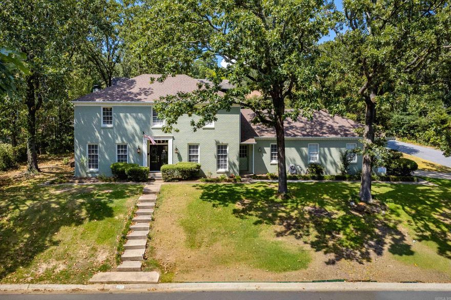 Southern charm with all the modern features! Beautifully updated brick traditional home has exceptional curb appeal and timeless style in sought-after Leawood. Floorplan is perfect for family living and entertaining. Spacious open living space with fireplace (gas logs), formal dining room, chef's kitchen with newer stainless steel appliances, pantry, breakfast room that overlooks the lovely landscaped backyard, wet bar, study and laundry room complete the main level. Upstairs features four nice sized bedrooms. Primary has walk in closet and updated ensuite bath. Abundant storage and pretty hall bath. Hardwood floors flow throughout main level and new laminate hardwood upstairs. Enjoy peace of mind with recent major updates: 2 zoned HVAC units (2018) roof (2023), hot water heater (2019), gutters/concrete board siding (2025), privacy fence enclosing beautifully landscaped backyard (2019) stainless kitchen appliances (2018). Just one block from the Leawood Pool and close to shopping and dining, this meticulously cared-for home is move-in ready and full of warmth, space and character with room for the whole family. Refrigerator, washer/dryer convey.  *Agents please see remarks.