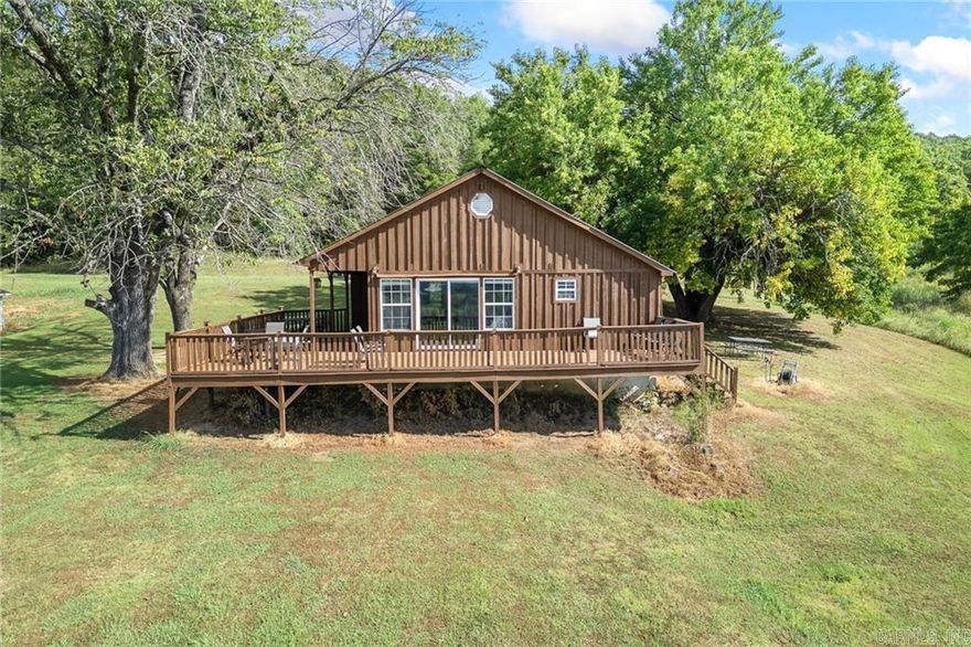 These type of opportunities don’t come up very often. 90 acres m/l, minutes from the Buffalo River, already established income, quiet country setting yet minutes from conveniences and accessible from pavement. This 2 bedroom, 1 bathroom home overlooks approximately 50 acres of established hayfields and has multiple outbuildings for hay storage. The spring fed pond can water your livestock or the hundreds of deer that graze in the pasture at night. This property has a lot of options, come check it out!!