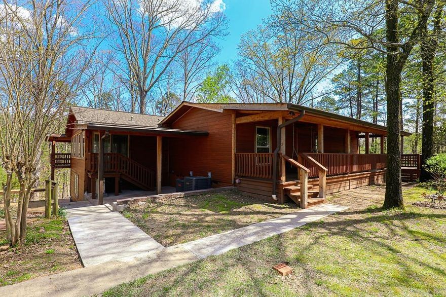 Country living! Minutes from Little Rock! Lake Views! Ever wanted to feel like you live in a treehouse? This is it! Tucked back on over 3 acres sits this 4 bed 3 bath and 1 half bath home. Enough rooms for everyone and any hobby. Sit on any of the spacious porches and sip coffee while looking over the lush landscape. Massive kitchen and dining area ready for those large family holiday gatherings. Primary bedroom and a large guest bedroom make up the main level. 2 bedrooms down and bonus areas throughout! 2 car garage on the lower level. Gated entry. Survey online for reference purposes only. Agents see remarks for showing information.