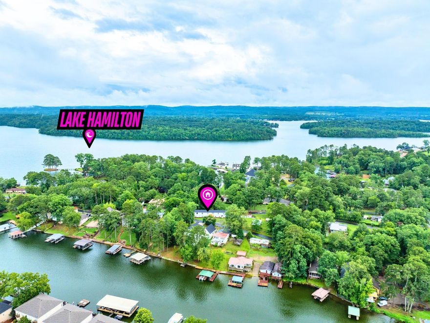 Investor Opportunity! Don’t miss this income-producing duplex located just across from Lake Hamilton in Hot Springs. Each spacious unit features 2 bedrooms—one unit with 2.5 baths, the other with 1.5 baths—plus generous living rooms, kitchens, and dining areas. With approximately 2,340 sq ft per unit, there’s plenty of space to attract quality tenants. Both units are available and ready for tenants —perfect for immediate rental income. Recent updates include new roofing and one new dual-fuel HVAC system. Additional property features include a separate 855 square foot building with a new roof (previously used as a 2 bed/1 bath rental and could be restored for added income), two storage units, and a utility hookup for a mobile home or RV. All just minutes from shopping, dining, and entertainment. Excellent location —schedule your viewing today! ***Agent See Remarks***