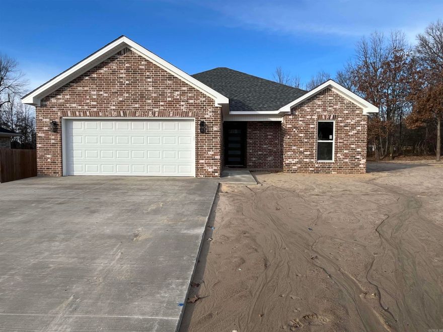 Welcome to this stunning new construction home that perfectly blends modern elegance with cozy charm. Featuring three bedrooms and two beautifully designed bathrooms, this residence offers an open floor plan that encourages seamless flow from room to room. The kitchen boasts exquisite quartz countertops, making meal prep a delight, while the tiled master shower provides a luxurious retreat. Enjoy the warmth of the inviting shiplap electric fireplace, complemented by wood accents on the living room ceiling, creating a unique focal point in the heart of the home. Step outside to the expansive covered back porch, perfect for entertaining or relaxing in your own private oasis. Situated on a desirable cul-de-sac lot, this home is ideal for families seeking tranquility and community. Don't miss the chance to make this dream home yours!