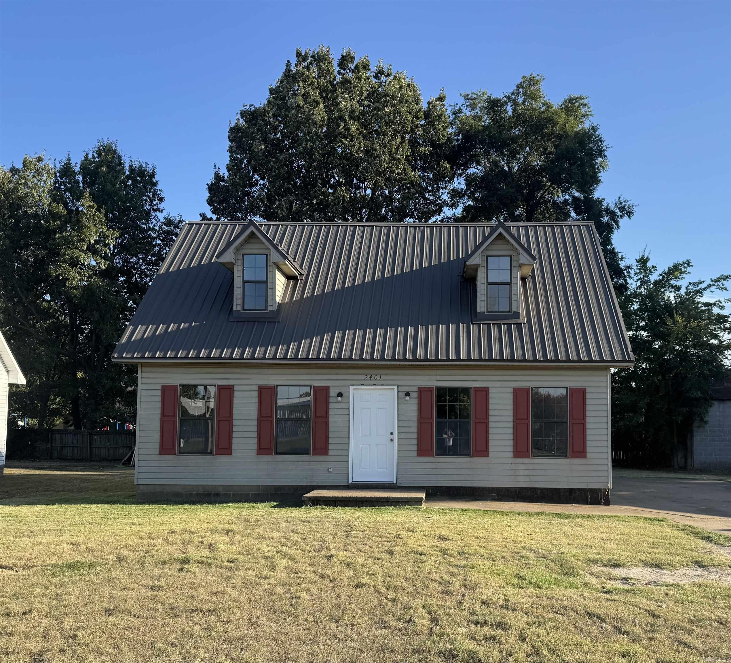 This 3 bedroom home has a fresh new coat of paint, new vinyl plank flooring, countertops, and lighting. The metal roof really sets it apart from the other homes along the street and offers you peace of mind down the road. There primary bedroom has it's own bathroom and there is a half bath downstairs for guests. Upstairs there is a bathroom for the two guest bedrooms.