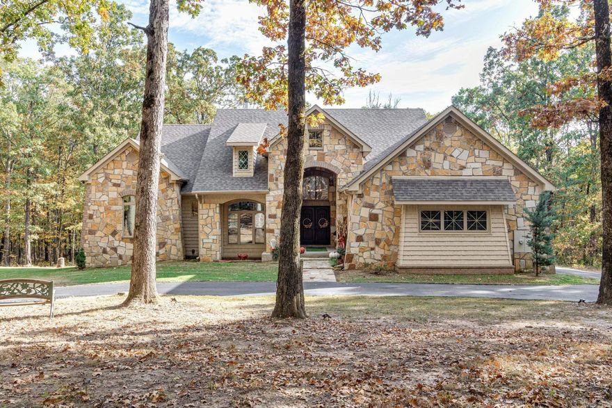 Nestled in the woods just like a tree house this Lodge styled home has it all. 2400 sf. shop w/elec & water, 9.84 acres of land, trails and deer stands, in-ground pool put in dec 2016 (aloha pools) New roof 2023, HVAC only 3 yrs, all electric home, Generator, Safe room, in-ground floor safe, Hardwood flooring added feb 2023, Main floor guest suite w/adjoining bath & double sinks, Granite Kitchen w/island bar, dining area and additional sunroom/formal dining room w/tons of glass windows allowing you to see the tree lined land and pool area, gas tank for generator only, California redwood mantle, stone accents, large laundry w/desk area, and lots of storage through out this home