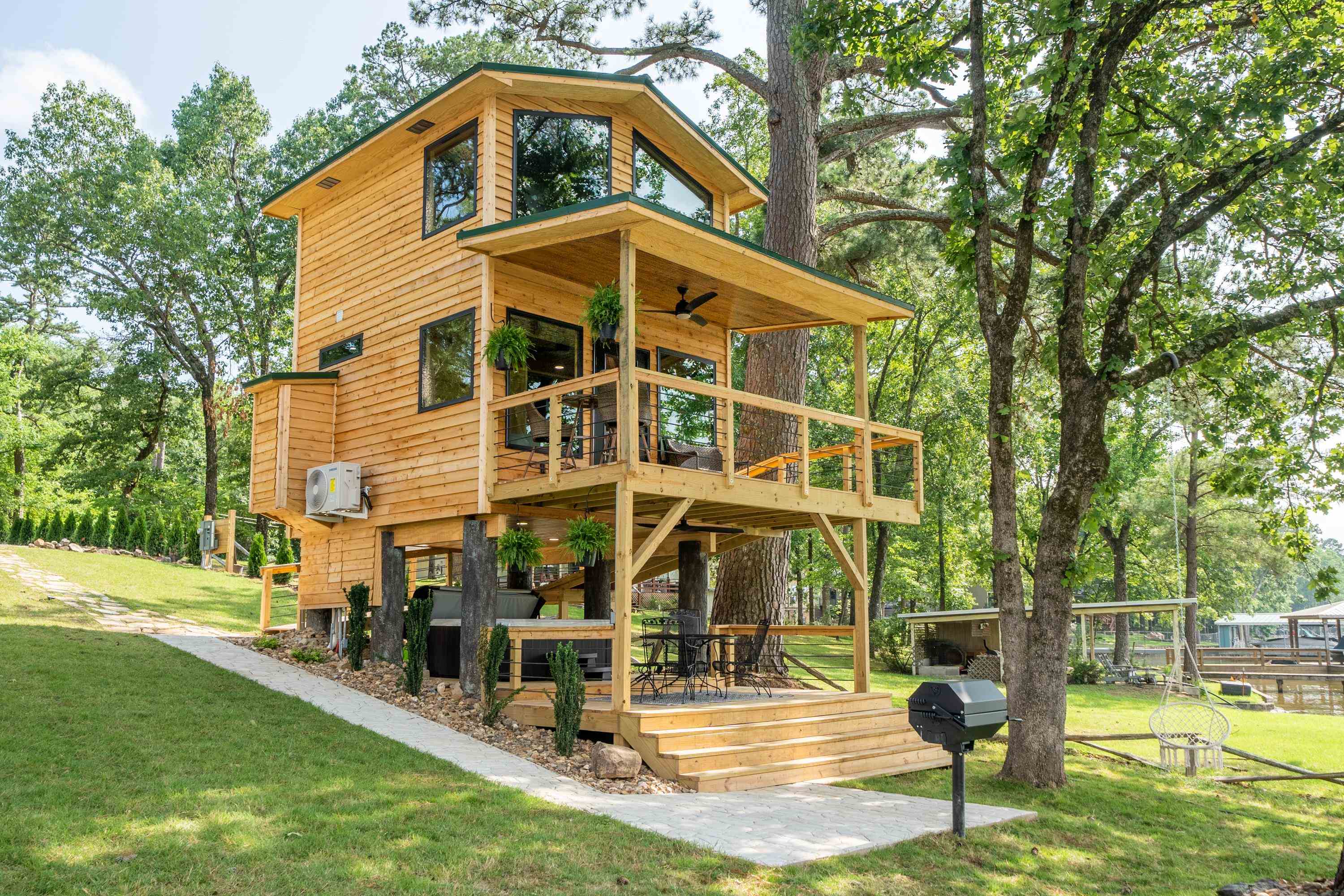 A One-of-a-Kind Lake Hamilton Property – Invest, Vacation or Build Your Dream Home! With 88 feet of lake frontage, this fully furnished cottage is a turnkey investment opportunity or the perfect private retreat. Currently operating as a short-term rental, the property is being sold completely furnished, allowing for a seamless transition for new owners. Lounge on the deck, unwind in the hot tub, or head straight to the water from your two stall stationary boat dock. Beyond its current charm, this property also offers incredible future potential. With underground utilities already in place, there is opportunity to build a primary residence while still maintaining the cottage as a guesthouse or income producing property. Additionally, with proper permitting from Entergy, the new owner can have exclusive access to an ajoining peninsula, expanding the possibilities for recreation and relaxation. Whether you’re looking for a vacation rental, weekend retreat, or a prime location to build your dream home, this property is a rare find.